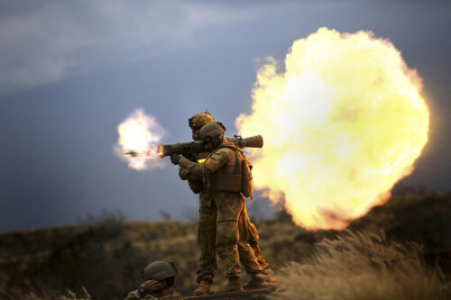 Australian soldiers fire an 84mm M3 Carl Gustave rocket launcher.